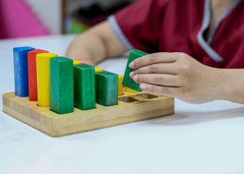 Occupational therapy: hand function training, Hand rehabilitation in stroke patient by using colorful blocks or cubes at a therapy room in the hospital.